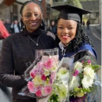 Hope Murera stands with her mentee Miriam during Miriam’s graduation at the University of Oxford as a Rhodes Scholar.
